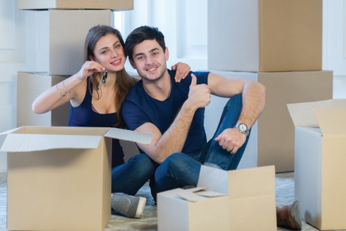 Removal team handling furniture safely during a house move