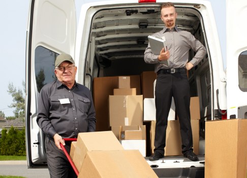Packed moving boxes and furniture prepared for local removal service