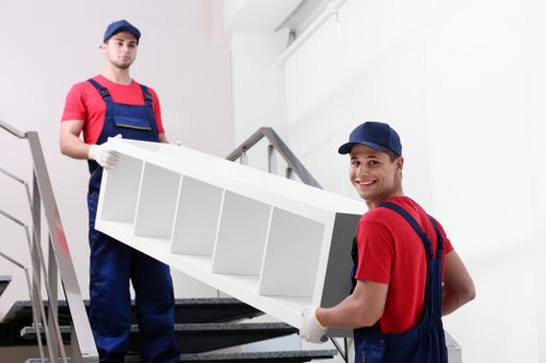 House movers carefully loading household items into a van