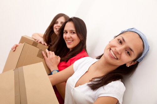 Packing and moving office furniture in a North London workspace