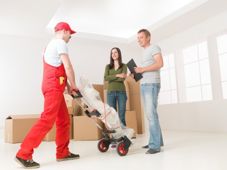 Movers handling furniture during a domestic relocation