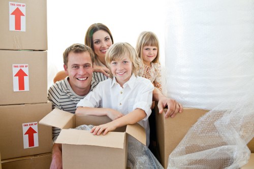 Professional movers loading furniture for a local relocation
