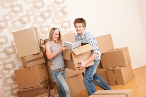 Team member securing furniture for transport in a removal van